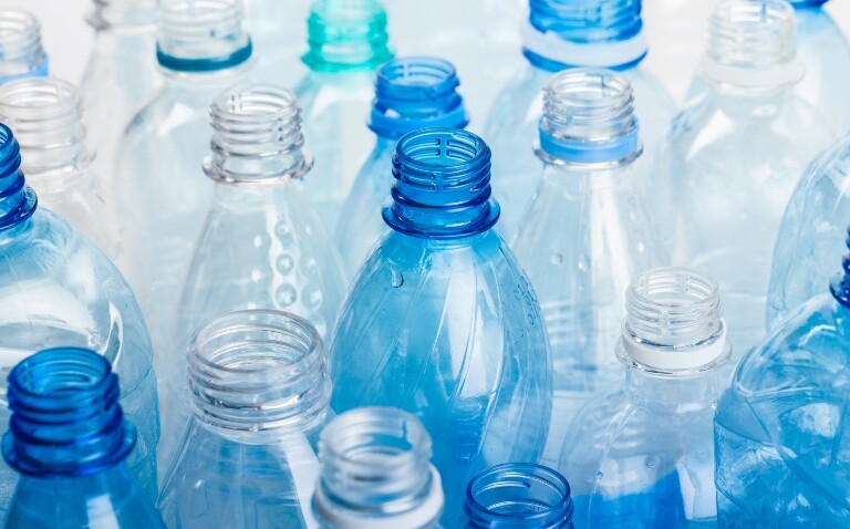 A close up of multiple plastic water bottles to illustrate the discovery that PET can be turned into sustainable paracetamol