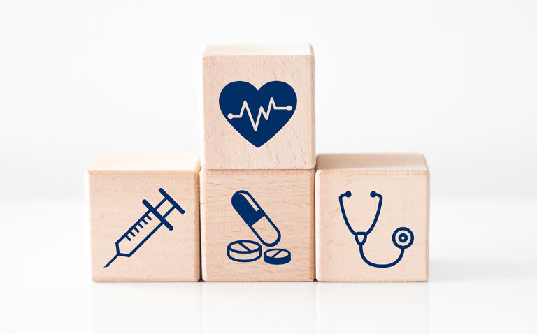 Four wooden blocks with a heart