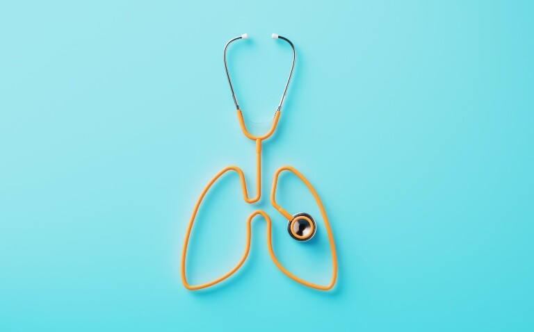 A yellow stethoscope on a blue background with the tubing creating the shape of a pair of lungs and the chest piece in the middle of the left lung to illustrate the new Clinical Excellence in Respiratory care event and its focus on respiratory infections