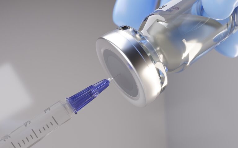 Close up of a syringe being filled from a vaccine vial to illustrate RSV vaccination and a drop in hospitalisations
