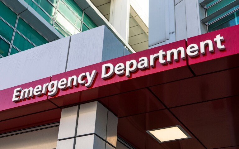 An Emergency Department sign above a hospital entrance to illustrate support for pharmacist integration in the ED