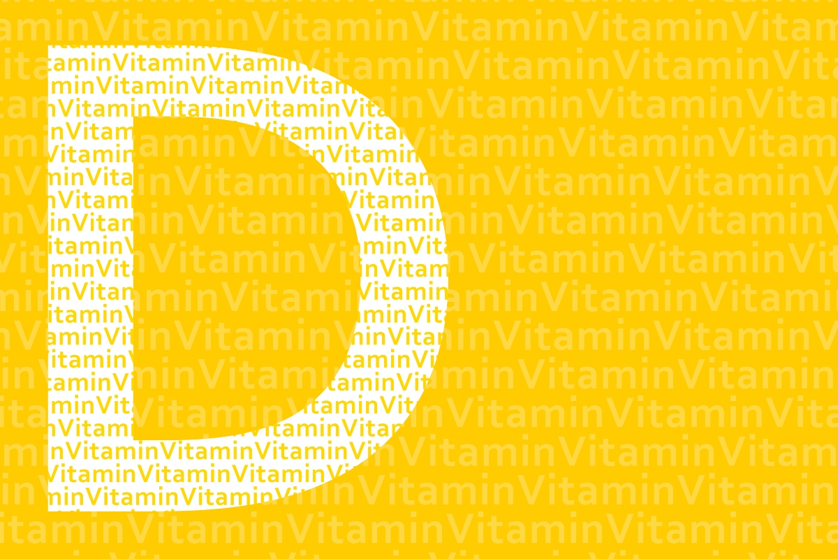 A light yellow D on a bright yellow background with the word vitamin in rows across it to illustrate the finding that Vitamin D deficiency increases risk of hospitalisation for respiratory infection