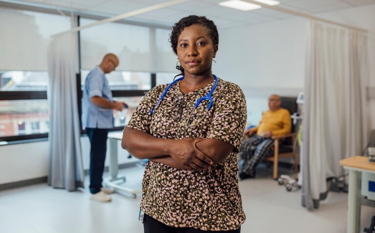 A portrait of a mid adult female doctor wearing a stethoscope