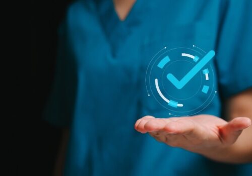 A close-up of a medic wearing scrubs with their hand outstretched and an illustration of a tick in a circle sitting above their palm to illustrate the finding that lutikizumab delivers clinically meaningful improvements in refractory hidradenitis suppurativa