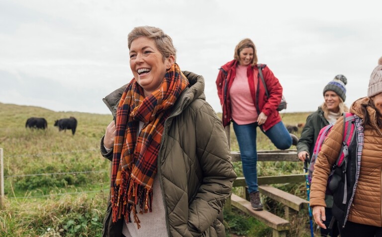 Four women wearing warm
