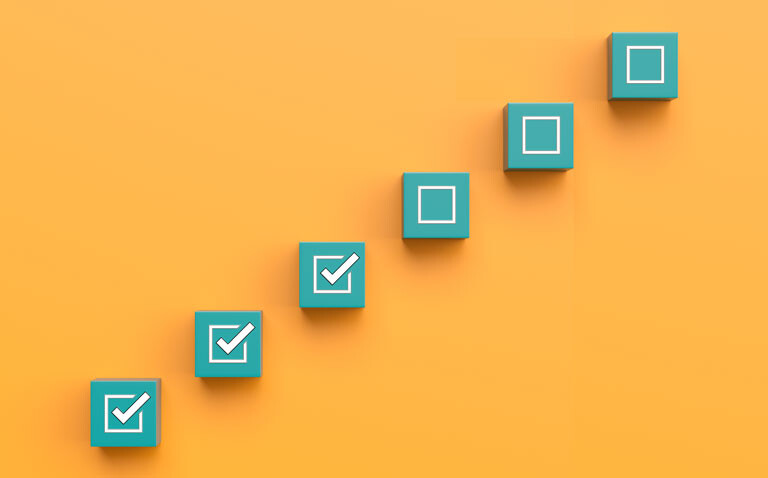 Six green blocks in a diagonal line on an orange background with the bottom three having white ticks in the centres to illustrate revised response criteria sharpening focus on underlying inflammation in RA