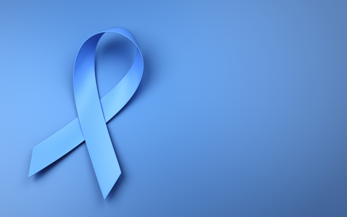 A light blue prostate cancer awareness ribbon on a matching blue background to illustrate the trajectory of prostate cancer diagnostics and treatment