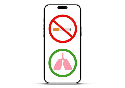An iPhone outline with a no smoking sign on the screen and a green circle with lungs in it underneath it to illustrate an mHealth smoking cessation intervention improving TB outcomes