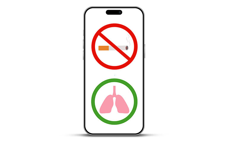 An iPhone outline with a no smoking sign on the screen and a green circle with lungs in it underneath it to illustrate an mHealth smoking cessation intervention improving TB outcomes