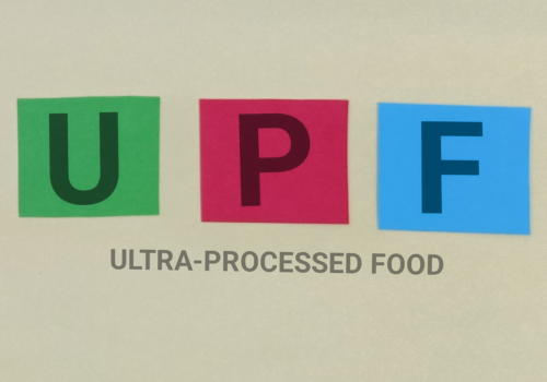 “Graphic displaying the acronym ‘UPF’ in large letters on colored blocks, with the words ‘Ultra-Processed Food’ written below to illustrate a new ESC consensus statement on the cardiovascular risks of UPF